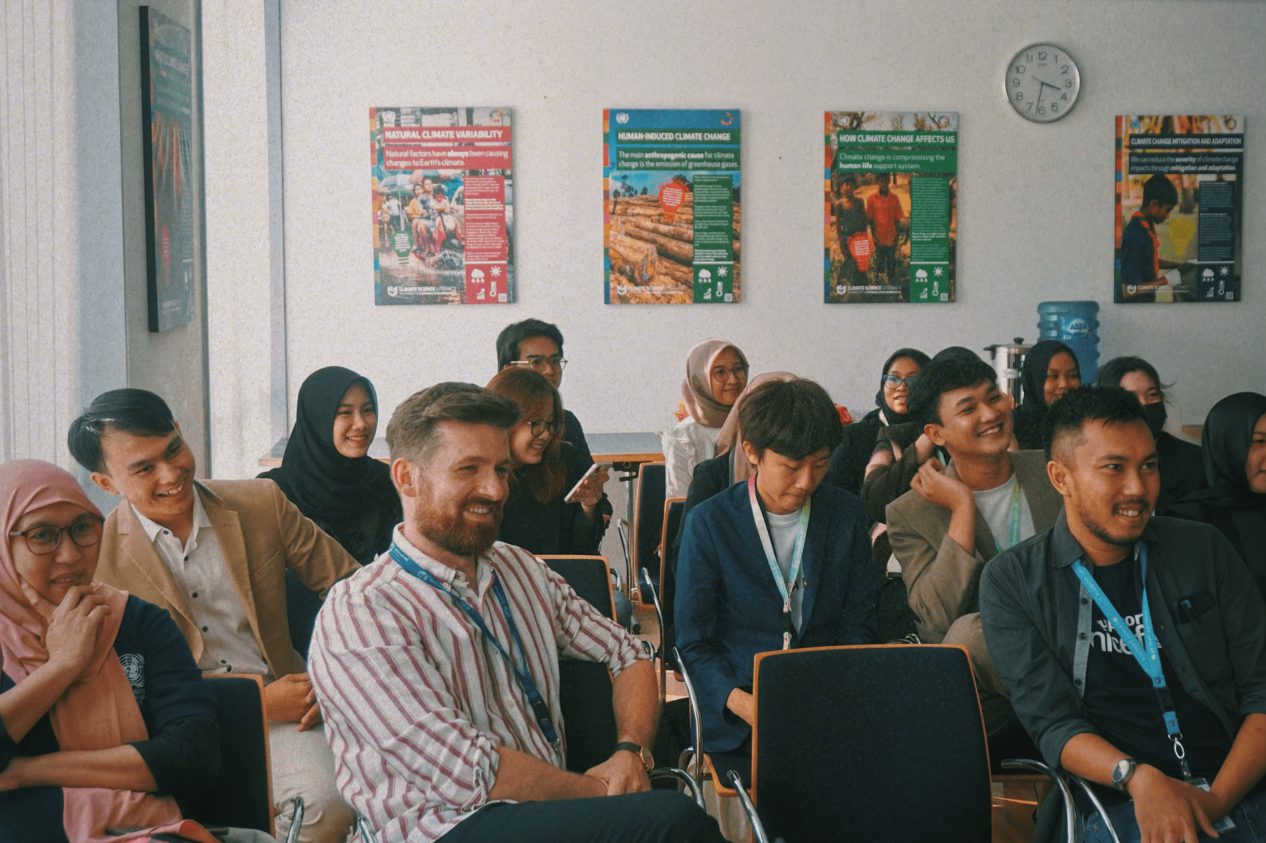 Participants smiling during an Impactional workshop
